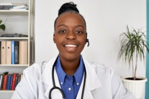 african female doctor wear headset make webcam zoom video call face headshot