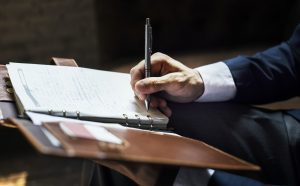 businessman writing a note