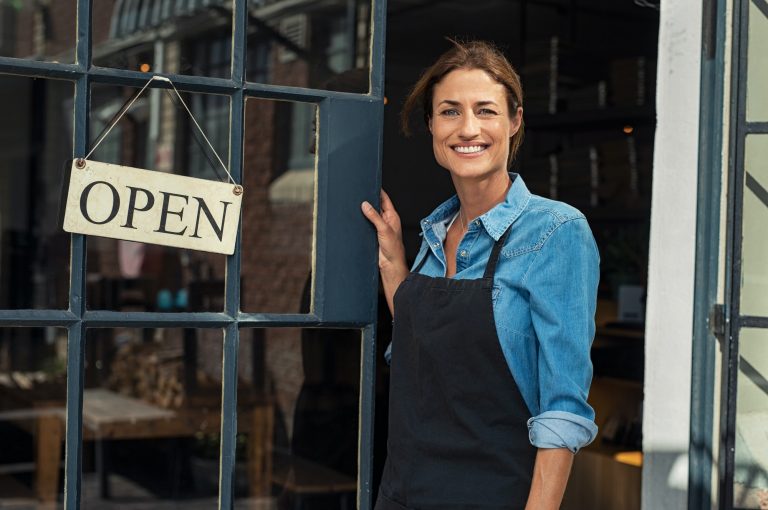 woman at small business entrance