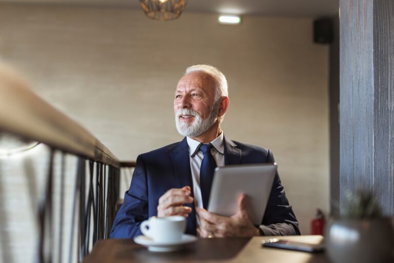Senior businessman working in a restaurant