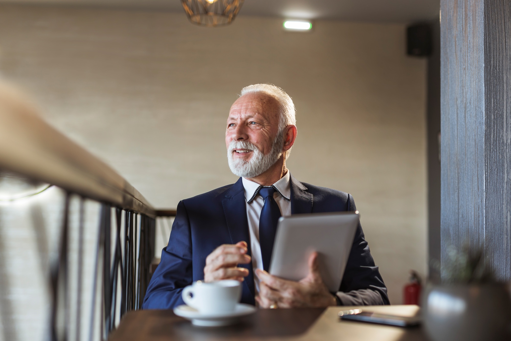Senior businessman working in a restaurant